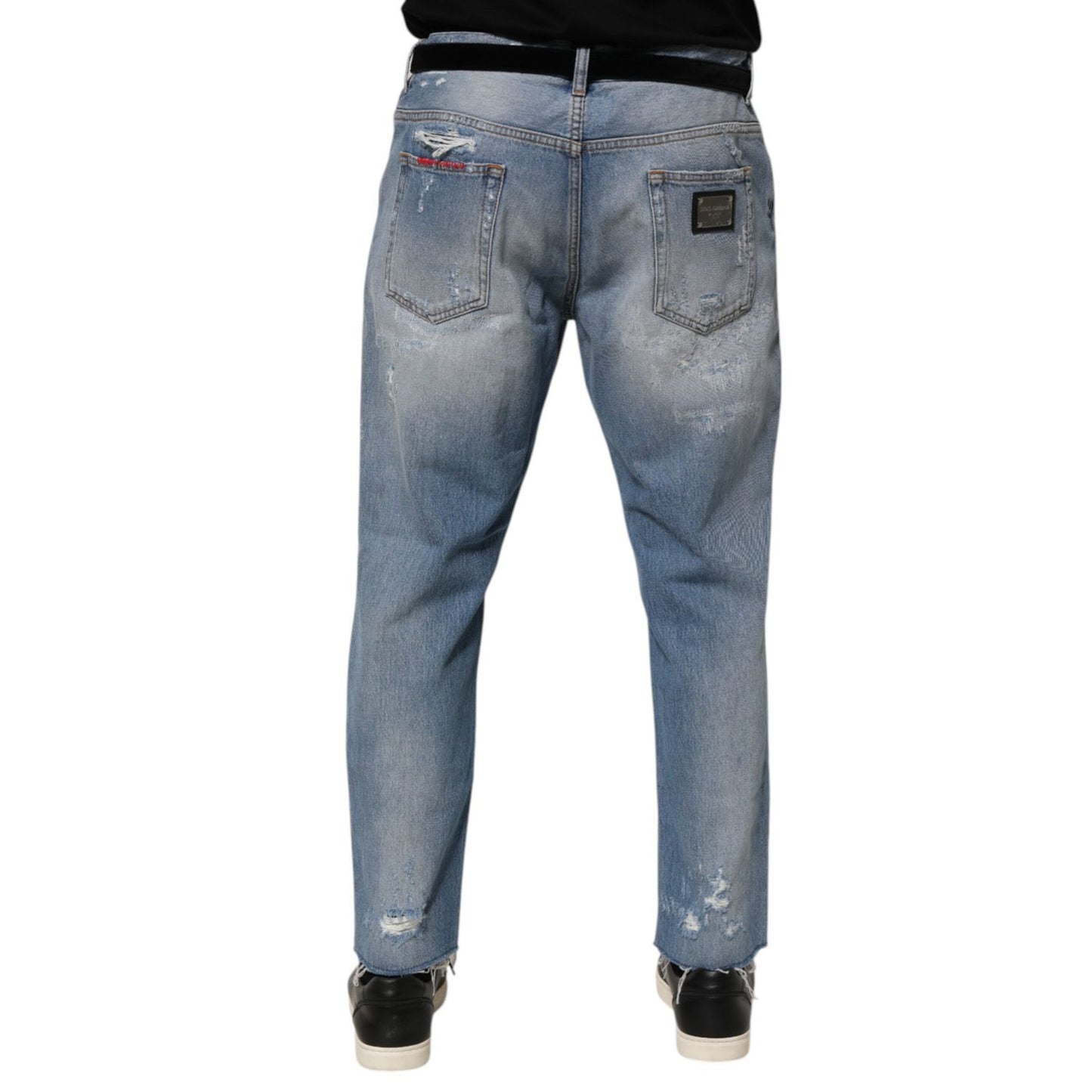 Dolce & Gabbana Blue Distressed Ripped Denim Pants Jeans with logo plaque on the back, showcasing modern streetwear style.