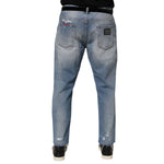 Dolce & Gabbana Blue Distressed Ripped Denim Pants Jeans with logo plaque on the back, showcasing modern streetwear style.