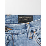 Dolce & Gabbana Blue Distressed Ripped Denim Pants Jeans with signature logo plaque on waistband, Italian-made premium cotton denim.