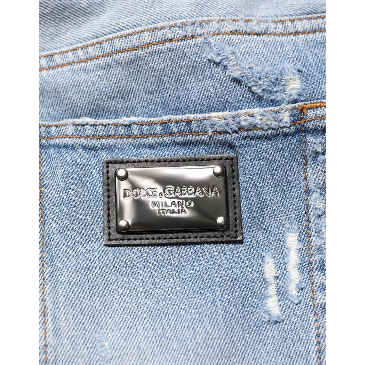 Dolce & Gabbana Blue Distressed Ripped Denim Pants Jeans with logo plaque detail on back pocket.