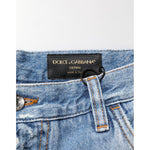 Dolce & Gabbana Blue Distressed Ripped Denim Trouser Jeans with logo plaque and button detail, Italian craftsmanship.