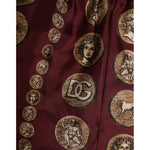 Dolce & Gabbana Burgundy Silk Coin Print Men Boxer Short Swimwear with luxurious ancient coin design and DG logo detailing.