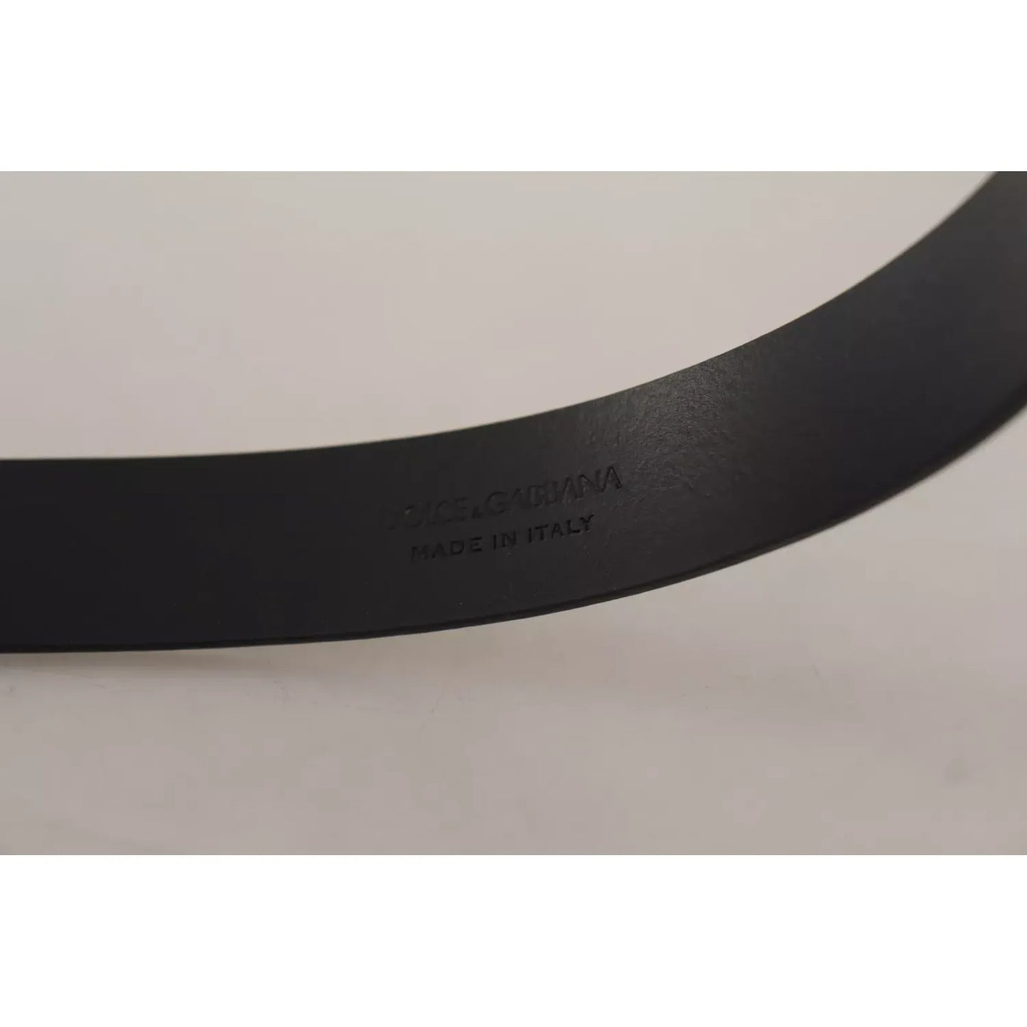 Dolce & Gabbana Calf Leather Silver Tone Black Metal Buckle Belt with 'Made in Italy' engraved, showcasing elegant craftsmanship.
