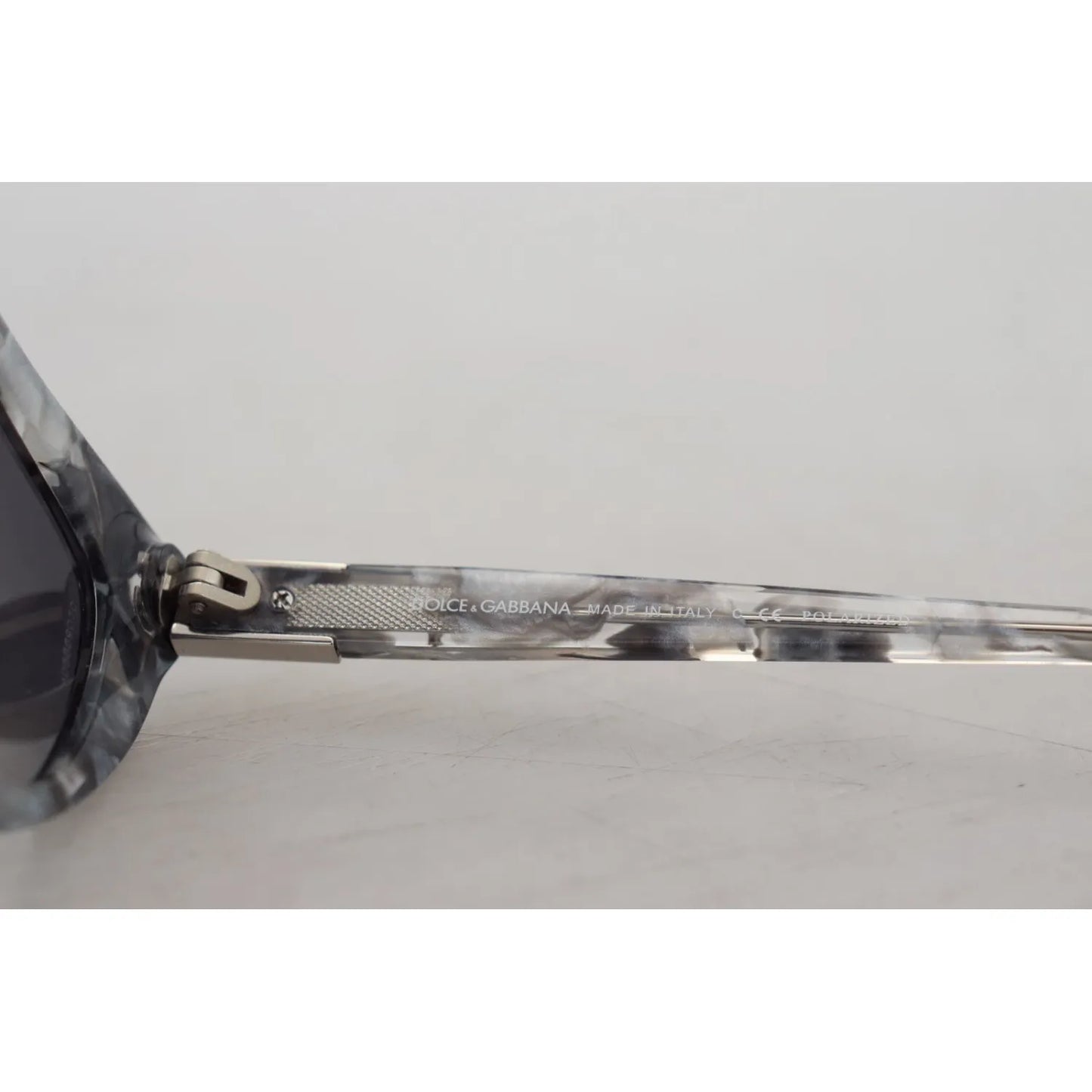 Close-up of Dolce & Gabbana DG4194 Gray Acetate Logo Plaque Cat Eye Lens Sunglasses showcasing side logo.