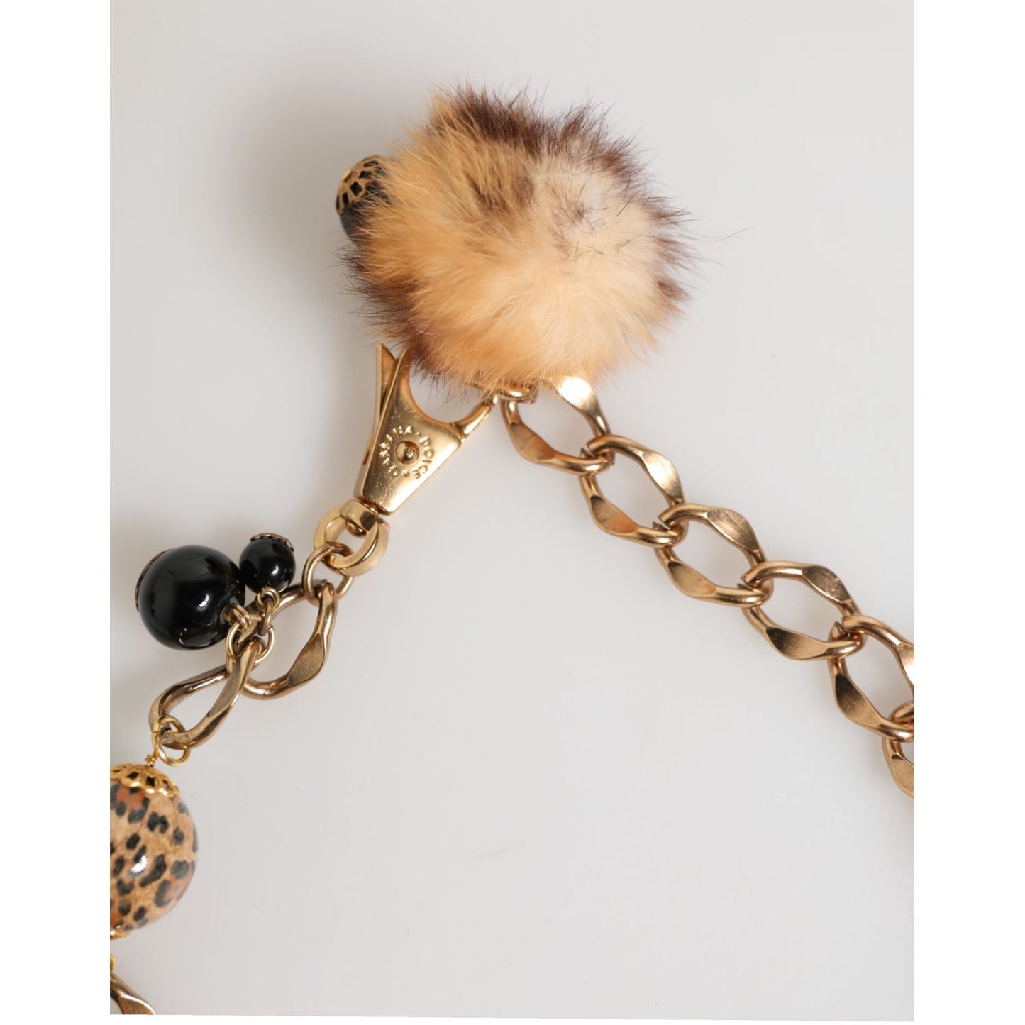 Dolce & Gabbana Gold Black Crystals Lapin Fur Filigree Choker Necklace with leopard-print enamel and fur pom-pom details.