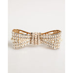 Dolce & Gabbana Gold Brass Glas Crystal Faux Pearl Embellished Brooch in elegant bow design