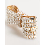 Dolce & Gabbana Gold Brass Glas Crystal Faux Pearl Embellished Brooch with elegant bow design, ideal statement accessory.