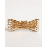 Dolce & Gabbana Gold Brass Glas Crystal Faux Pearl Embellished Brooch featuring elegant bow design with shimmering accents.