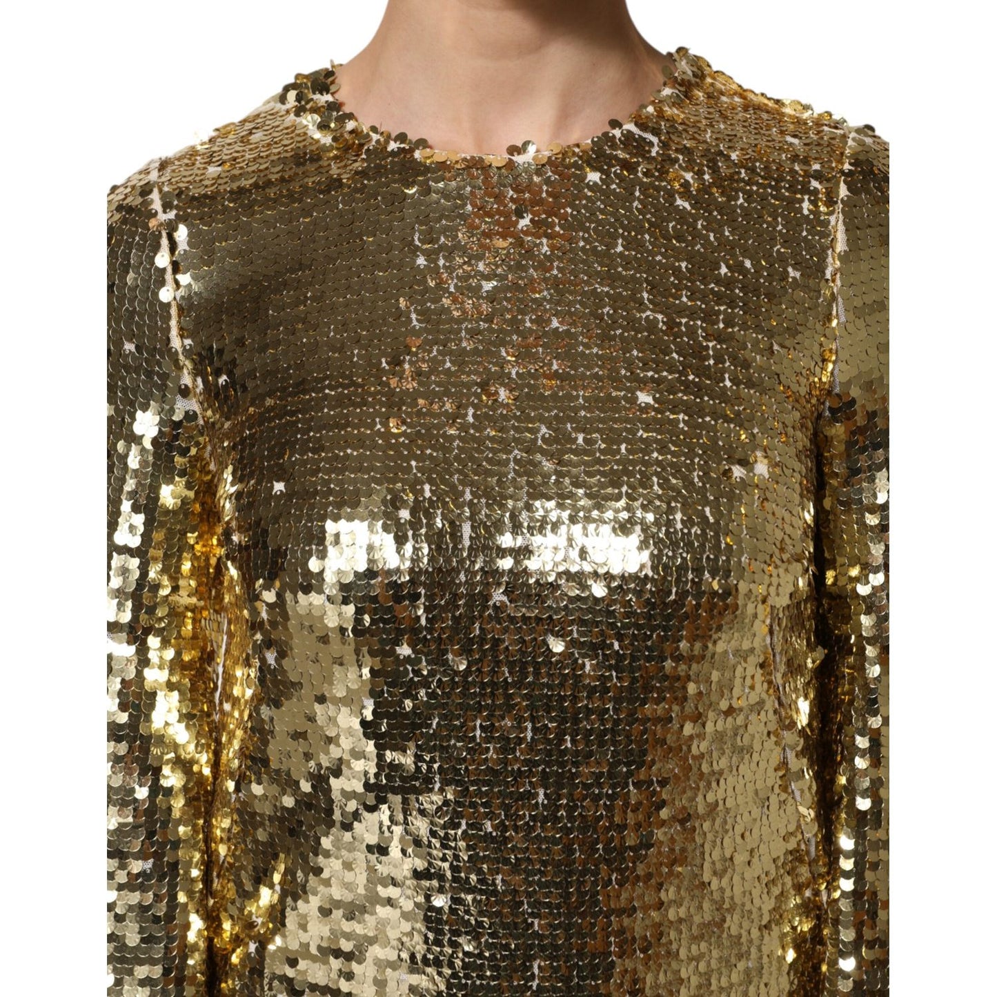 Dolce & Gabbana Gold Sequin Long Sleeve Mini Dress close-up, showcasing shimmering sequins and round neckline detail