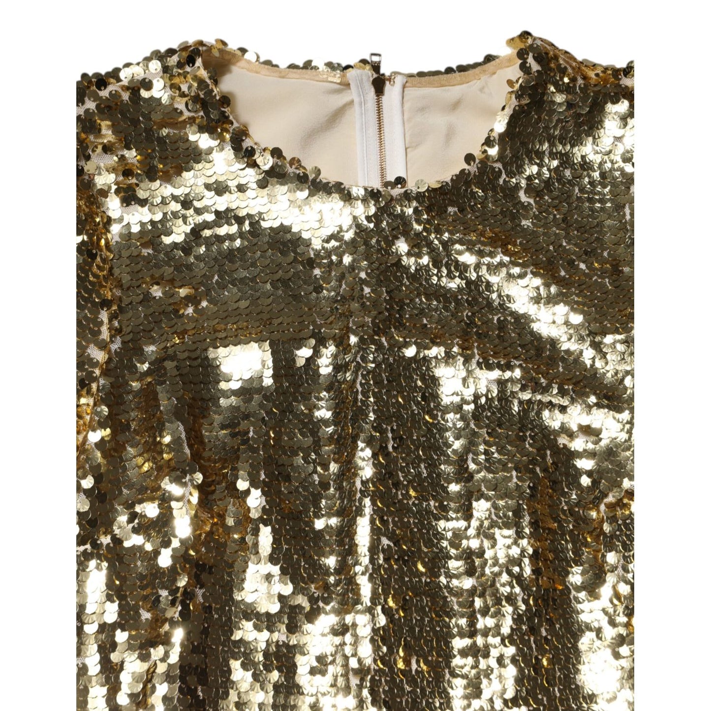Close-up of Dolce & Gabbana Gold Sequin Long Sleeve Mini Dress with zipper closure and round neckline.