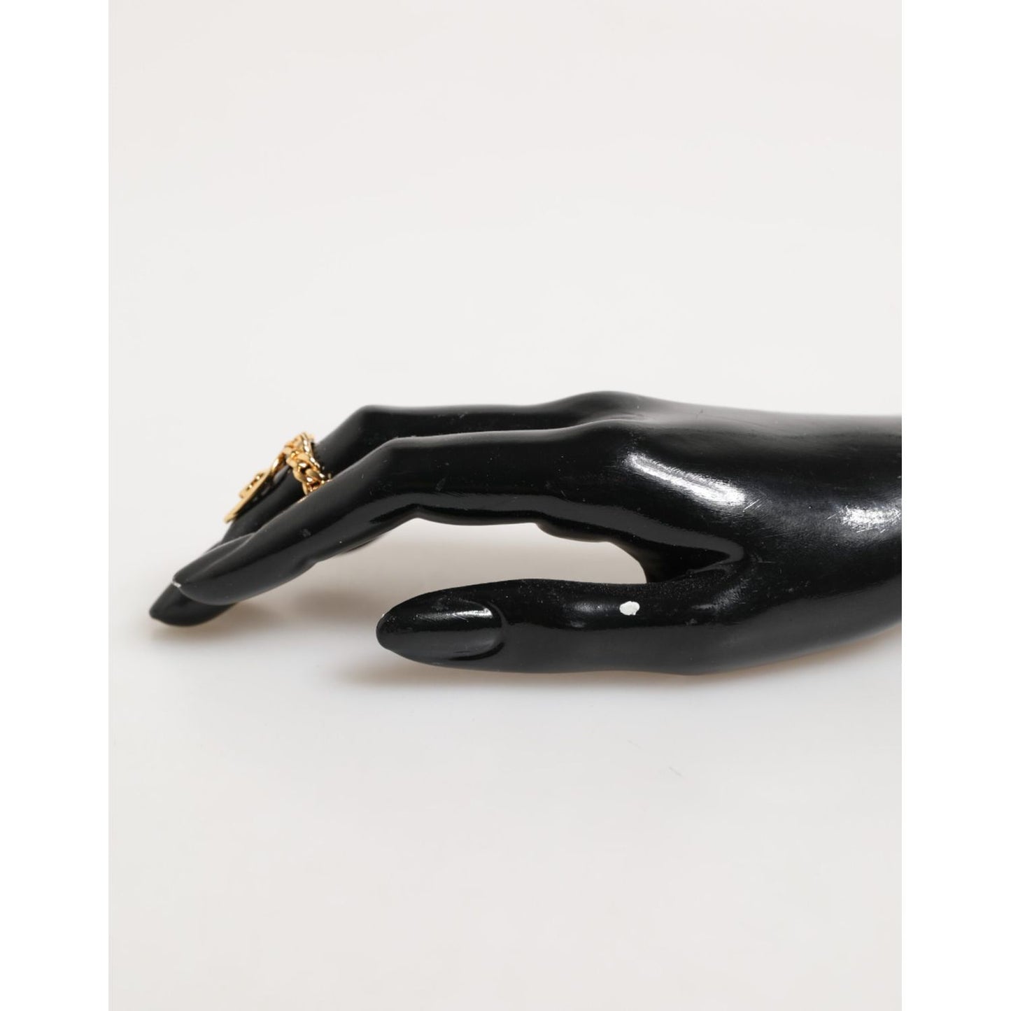 Dolce & Gabbana Gold Tone Brass Oval DG Logo Chain Adjustable Ring on display