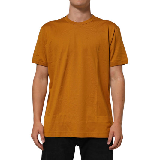 Dolce & Gabbana Golden Brown Crew Neck Short Sleeve T-shirt in premium cotton, modeled by a person, showcasing Italian style and logo details.