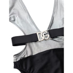 Dolce & Gabbana Gray Viscose One-Piece Swimsuit in silver and black with logo belt, long sleeves, and deep neckline, close-up view.