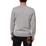 Back view of Dolce & Gabbana Gray Wool Knit Logo V-Neck Pullover Sweater, worn by a model, highlighting the elegant knit design.