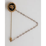 Dolce & Gabbana Lapel Pin DG Logo Gold Chain Mens Accessories Brooch with crystal embellishments, luxury branding on black and gold.