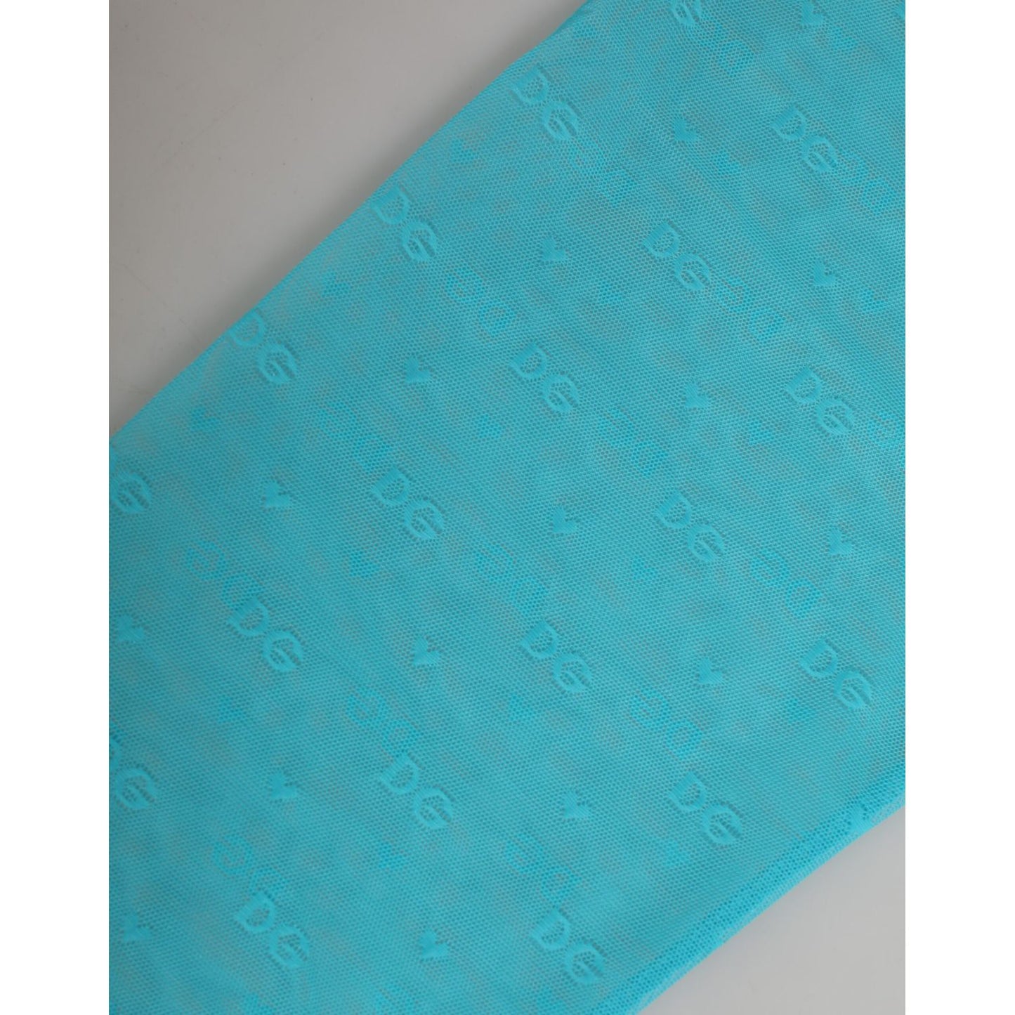Dolce & Gabbana Light Blue Logo Lace Tight Midi Trouser Underwear featuring delicate logo-patterned lace design.