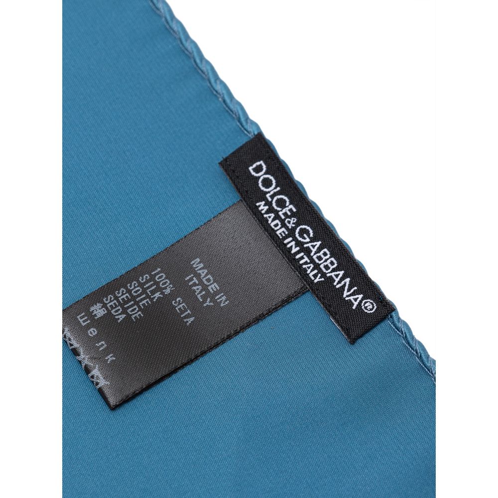 Dolce & Gabbana Light Blue Silk Pocket Square with label showing 100% silk composition.