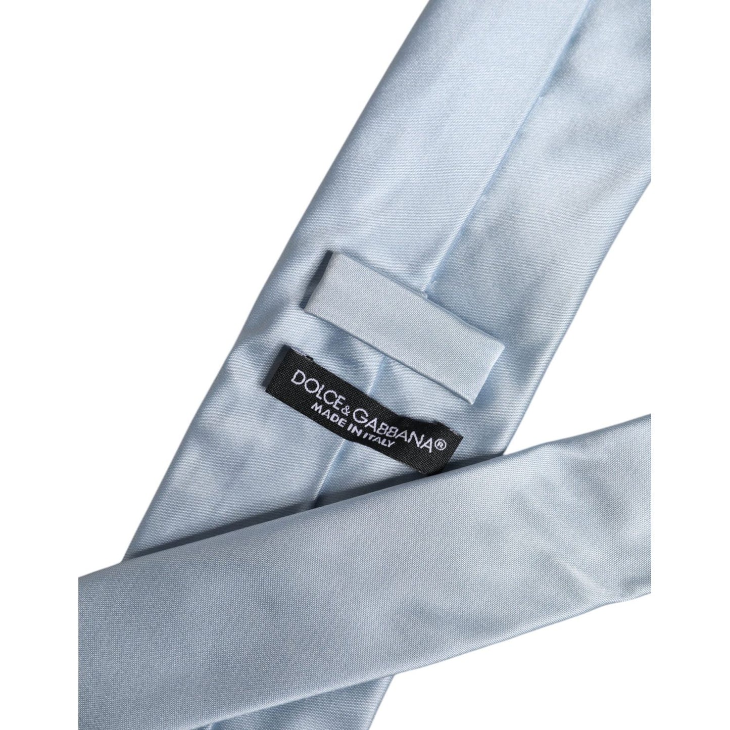 Dolce & Gabbana Light Blue Solid Silk Adjustable Necktie Tie, 100% Silk, Made in Italy, showing label and material detail.