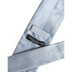 Dolce & Gabbana Light Blue Solid Silk Adjustable Necktie Tie, 100% Silk, Made in Italy, showing label and material detail.
