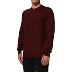 Dolce & Gabbana Maroon Cashmere Crew Neck Pullover Sweater modeled, featuring ribbed hem and cuffs, elegant and sophisticated design.