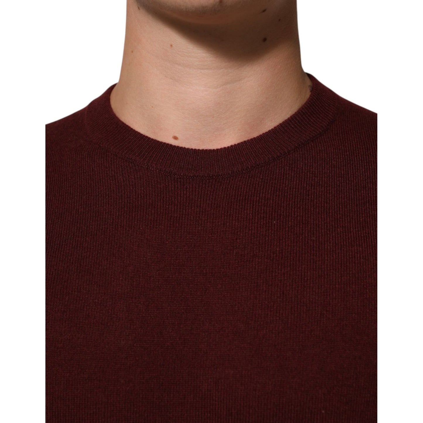 Dolce & Gabbana Maroon Cashmere Crew Neck Pullover Sweater close-up showing ribbed hem and elegant design.