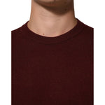 Dolce & Gabbana Maroon Cashmere Crew Neck Pullover Sweater close-up showing ribbed hem and elegant design.