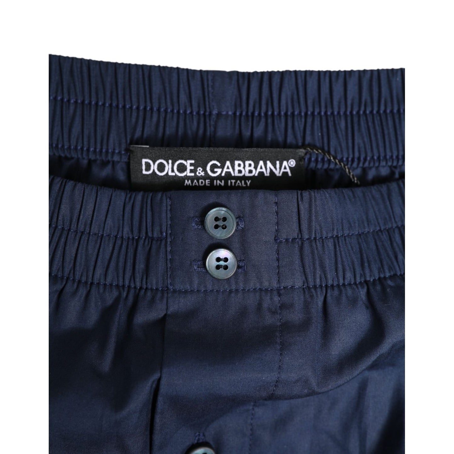 Close-up of Dolce & Gabbana Navy Blue Cotton Elastic Waistband Button Swimwear featuring elastic waistband and button details.