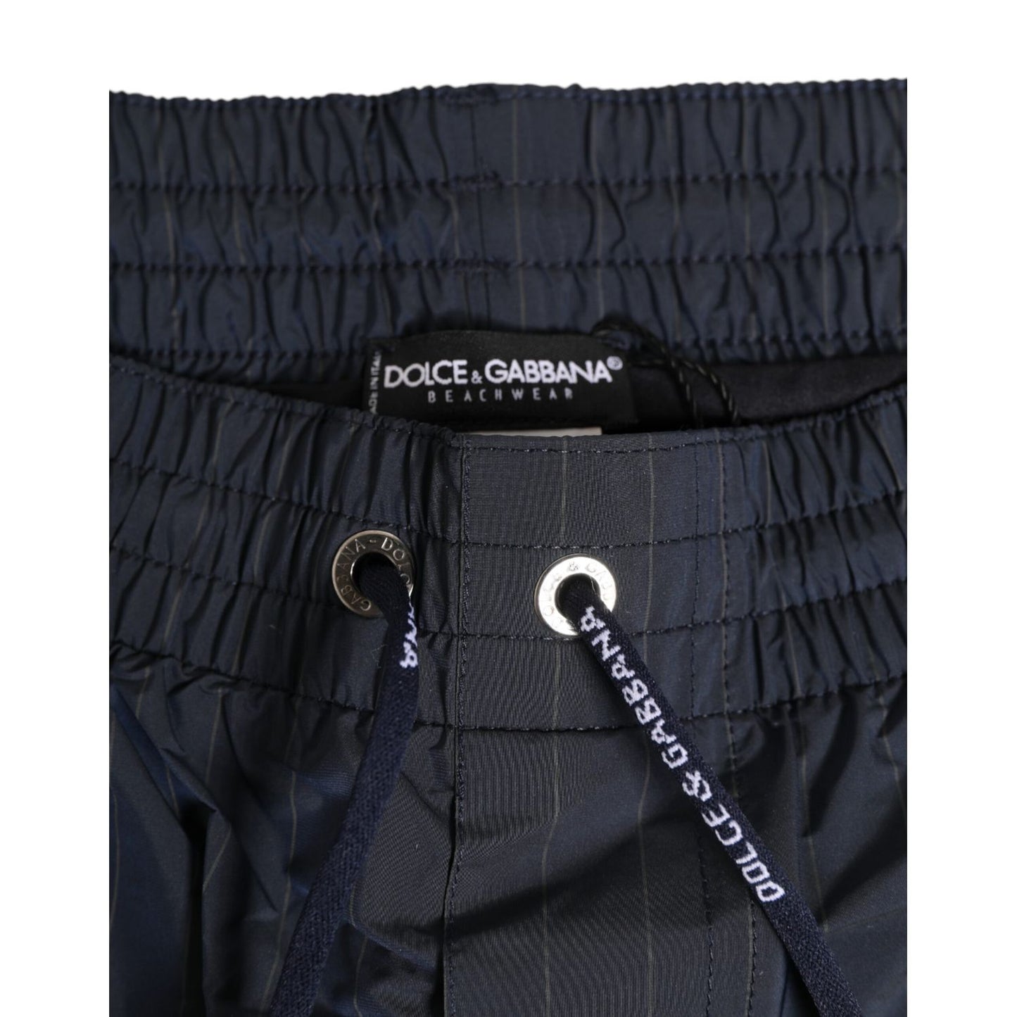 Dolce & Gabbana Navy Blue Polyester Nylon Pinstripe Men's Swimwear with elastic waistband and drawstring logo detailing.