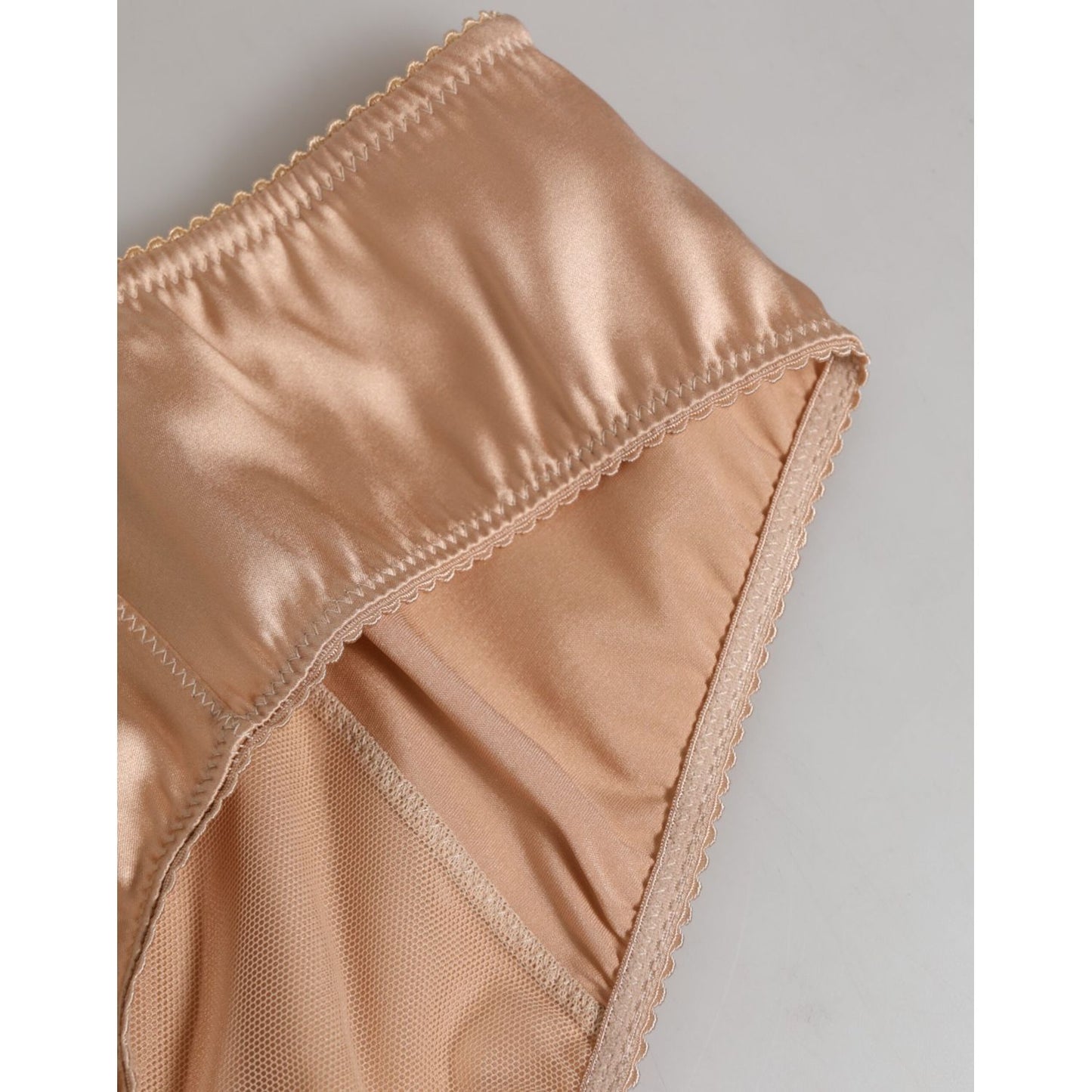 Dolce & Gabbana Nude Beige Silk Satin Stretch Bow Briefs Underwear with lace trim and bow detail, shown in close-up.