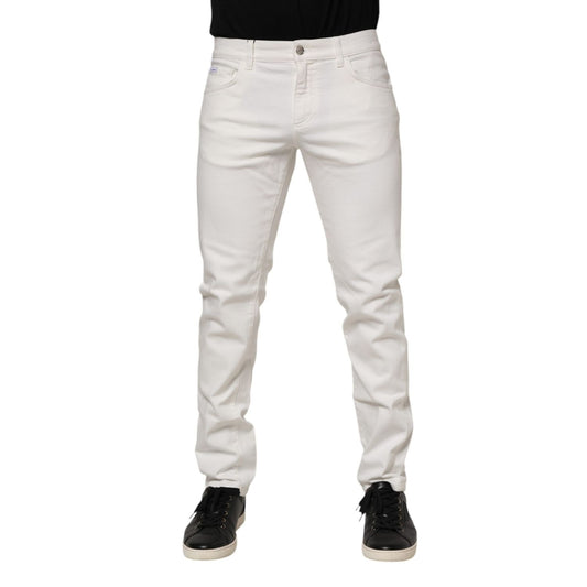 Model wearing Dolce & Gabbana Off White Cotton Stretch Slim Fit Denim Jeans with black shoes.