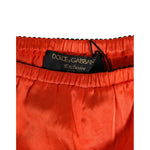 Dolce & Gabbana Red Silk Satin Lace Shorts Underwear, featuring black lace trim and brand logo, made in Italy for elegant sleepwear.