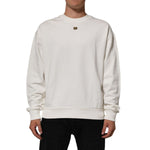 Dolce & Gabbana White DG Logo Crew Neck Sweatshirt Sweater with ribbed cuffs and logo plaque detail, worn by model. Cotton fabric.
