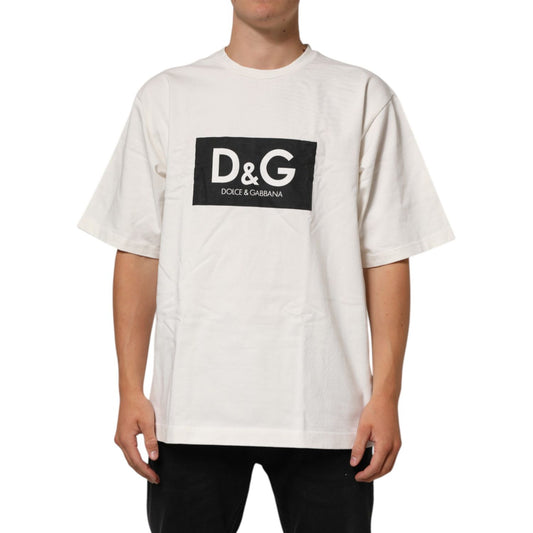 Man wearing Dolce & Gabbana White Logo Print Cotton Crew Neck Men T-shirt with black logo on front.