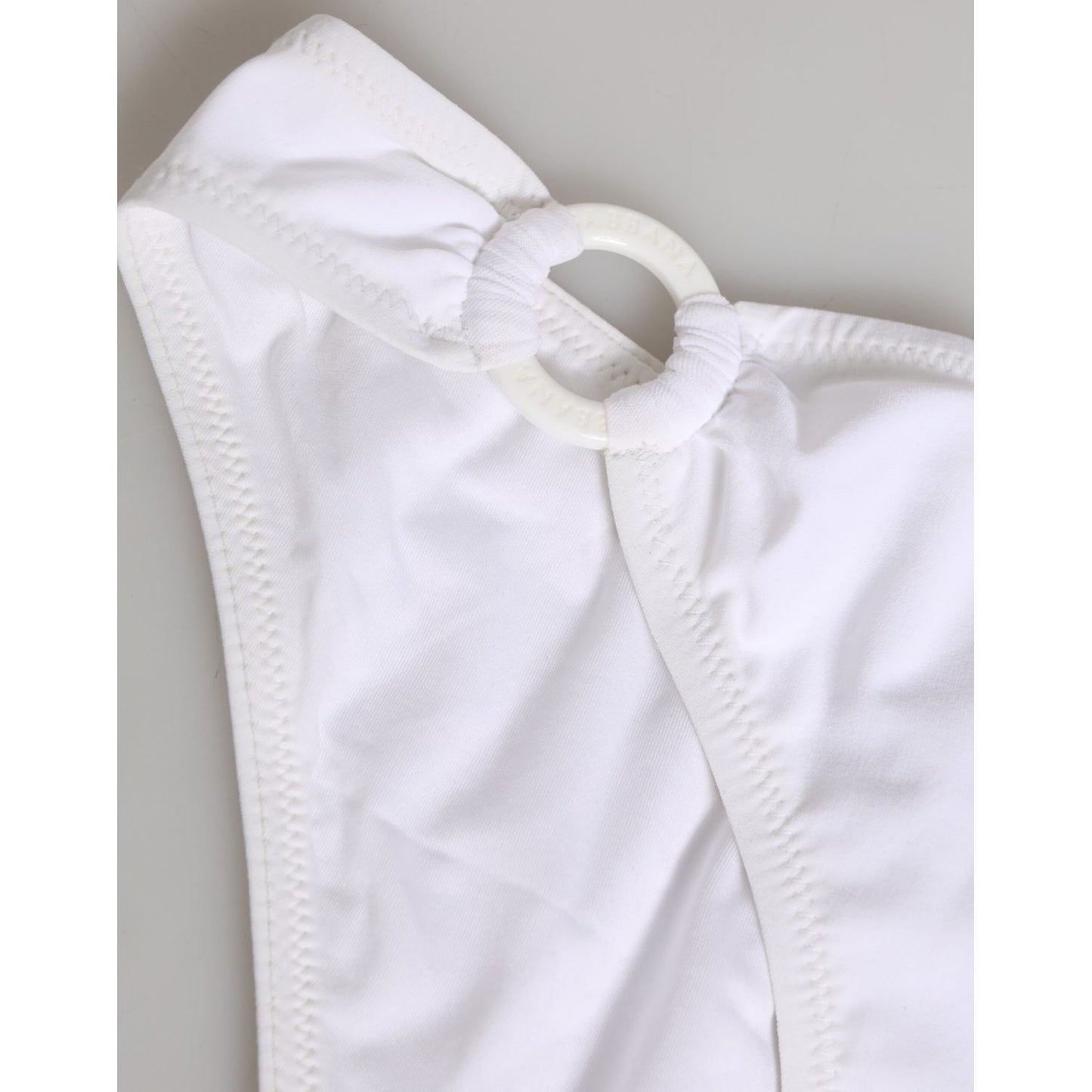 Dolce & Gabbana White Logo Swimsuit 2 Piece Top Bottom Swimwear close-up of white fabric and design detail.