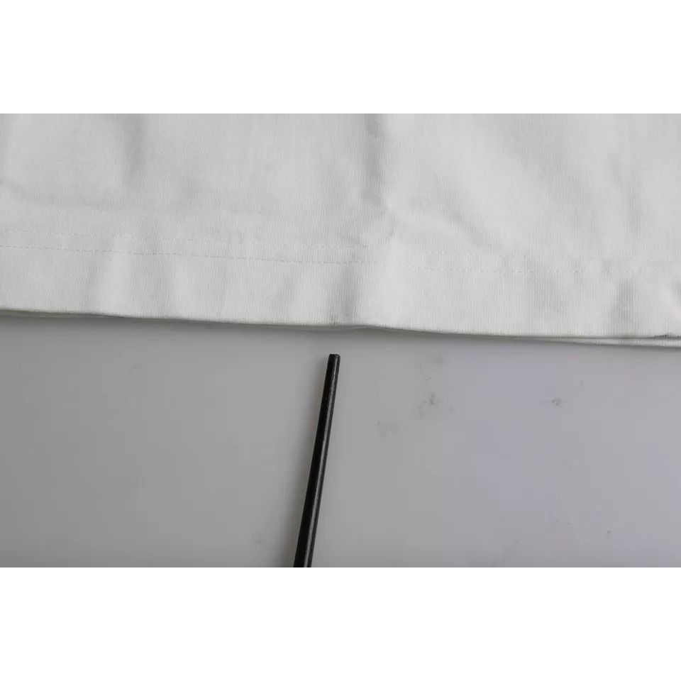 Image showing a section of the Dolce & Gabbana White Love & Peace Cotton Round Neck T-shirt with minor defect marks on the fabric.