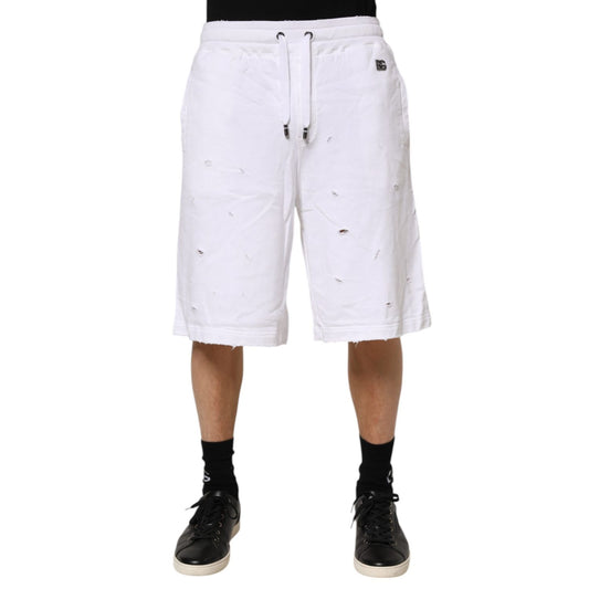 Dolce & Gabbana White Ripped Mid Waist Casual Bermuda Short in crisp white cotton with trendy ripped details, regular fit for summer style.