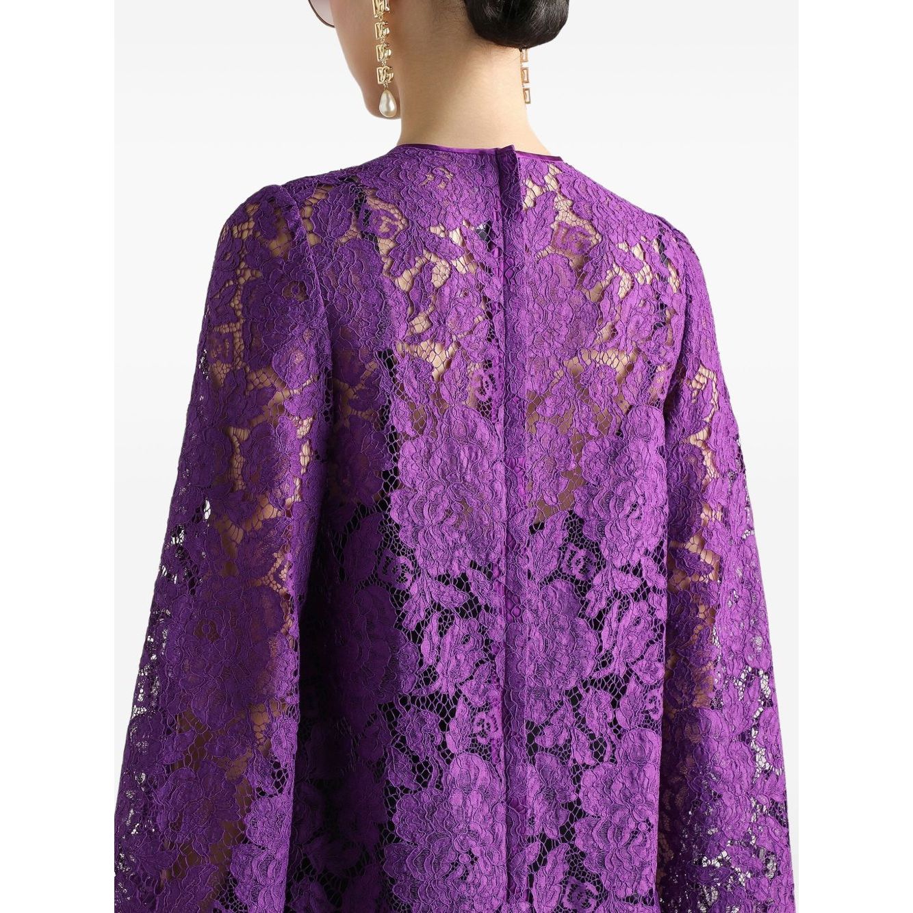 Back view of Dolce & Gabbana bell sleeves Lace mini dress in amethyst purple showing lace detail and rear zip fastening.