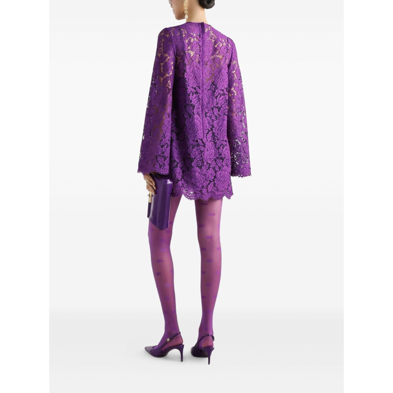 Model wearing Dolce & Gabbana bell sleeves Lace mini dress in amethyst purple with rear zip and crew neck, featuring bell sleeves and lace details.