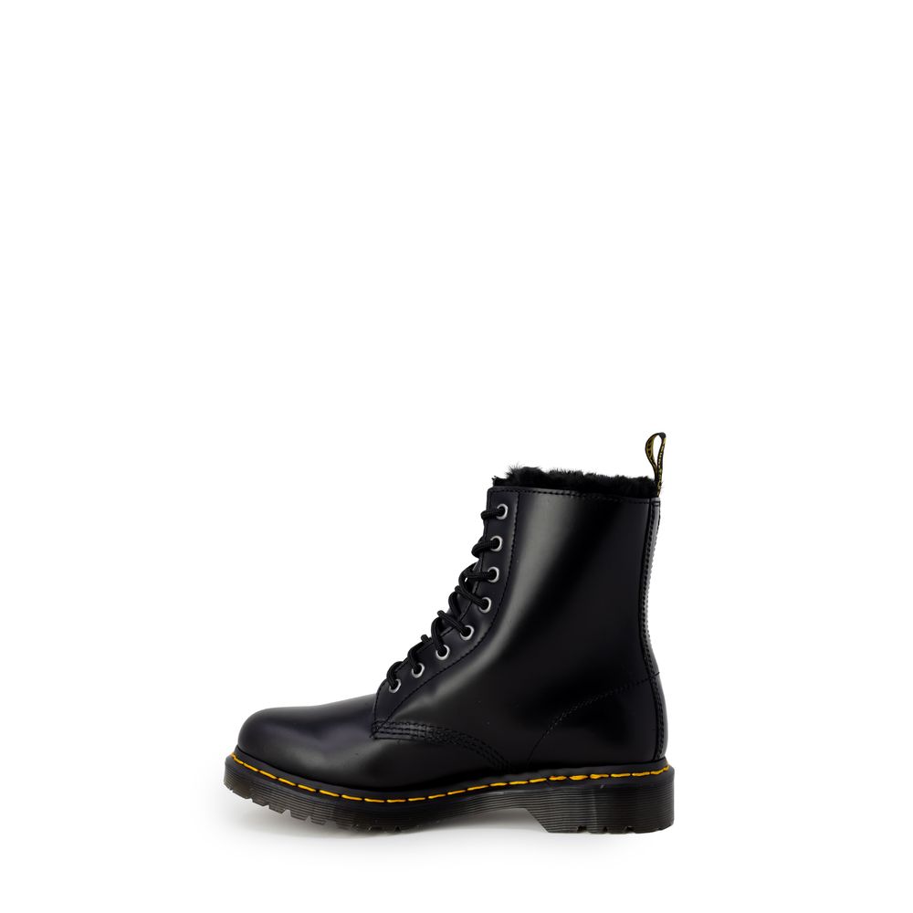 Dr. Martens Black Leather Boot with lace-up, rubber sole, iconic design for women, perfect balance of style and comfort.