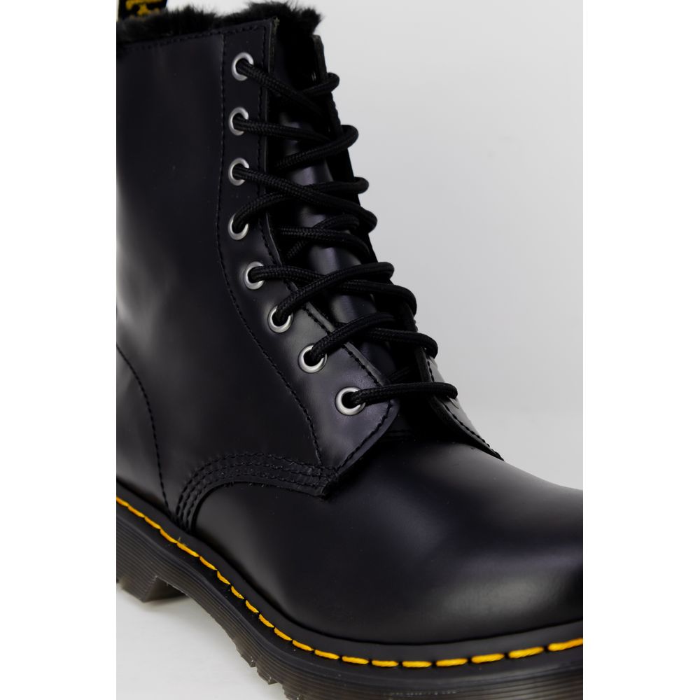 Dr. Martens Black Leather Boot with lace-up design and sturdy rubber sole, close-up view