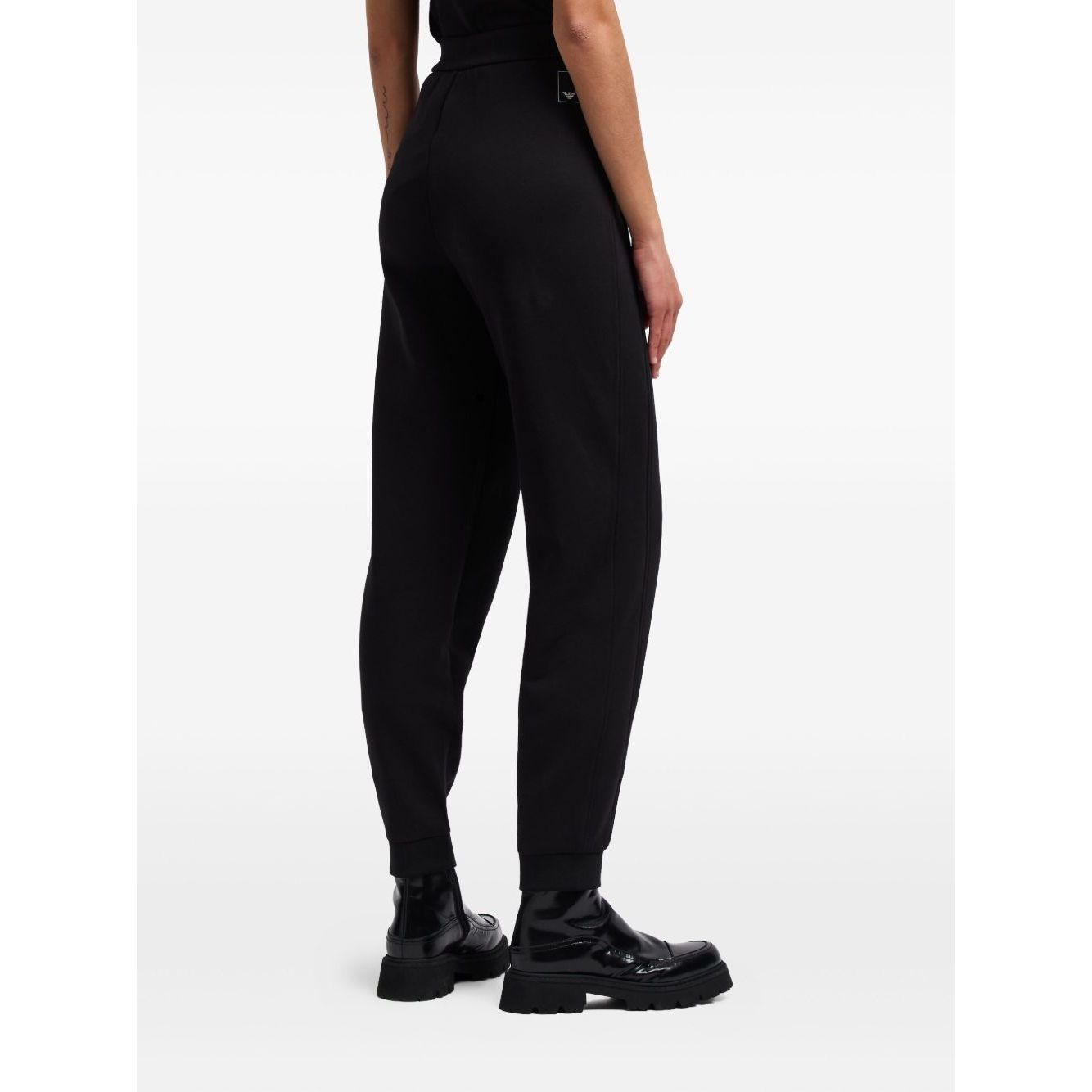 EMPORIO ARMANI CAPSULE Trousers Black with elastic waistband, ribbed ankles, side pockets, cotton material; back view.
