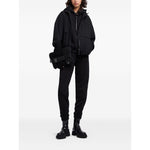 EMPORIO ARMANI CAPSULE Trousers Black with elastic waistband and ribbed ankles, featuring side pockets and cotton fabric.
