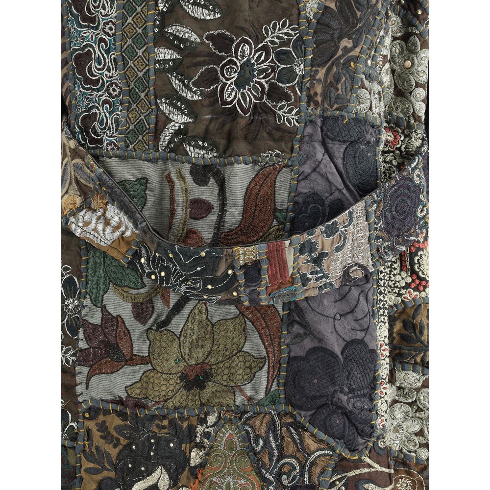 Close-up of Ella Multicolor Cotton Clothing patchwork with embroidered inserts and rich floral design for AW25 season