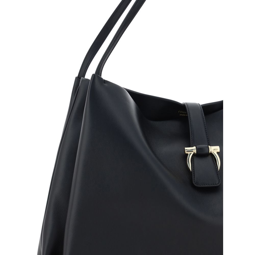 Close-up of Ferragamo Black Calf Leather Bos Taurus Handbag with double handles and magnetic flap closure