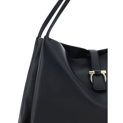 Close-up of Ferragamo Black Calf Leather Bos Taurus Handbag with double handles and magnetic flap closure