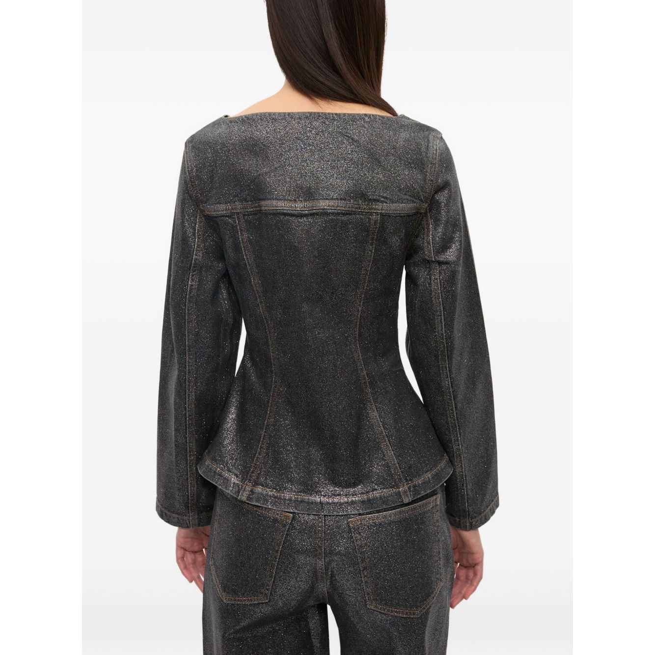 Back view of GANNI Jackets Black, denim cotton blazer with peplum waist and chest flap pockets, showcasing stylish design.