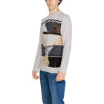 Model wearing Gianni Lupo Beige Marabou Sweater from men's fall/winter collection with abstract design.