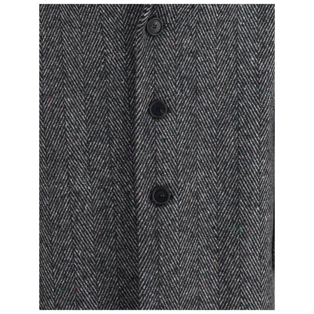 Close-up of Givenchy Gray Wool Coat with herringbone pattern and buttons, showcasing sophisticated style for AW25 season.