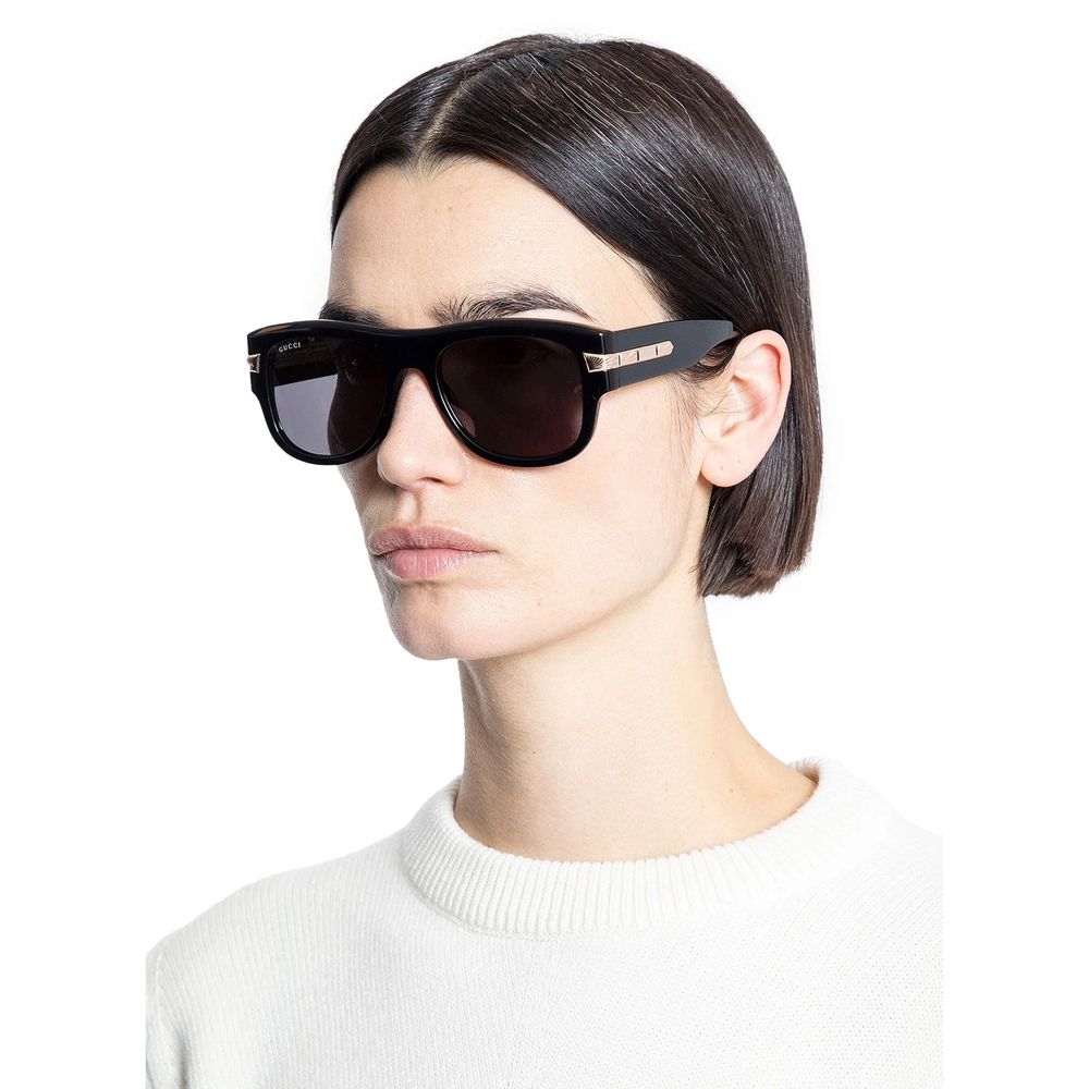Gucci Black Acetate Sunglasses with shiny black frame, worn by a model, offering 100% UVA/UVB protection, made in Japan.