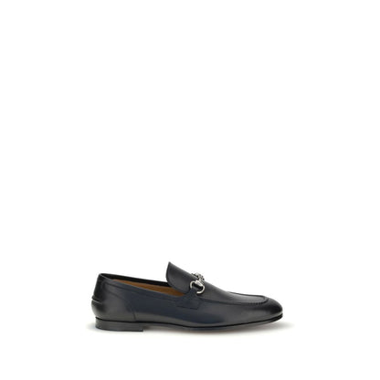 Gucci Black Calf Leather Bos Taurus Slip-On Loafers with Morsetto detail and logo embossed interior, perfect for casual and formal looks.